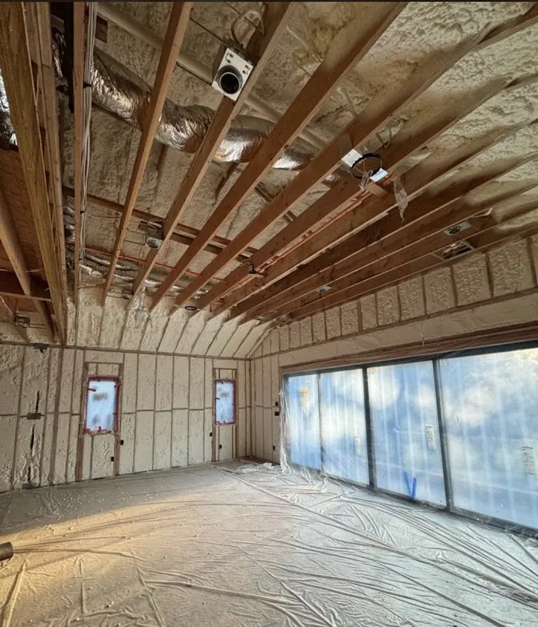 Interior walls and ceiling insulated with spray foam during new construction in Port St. John